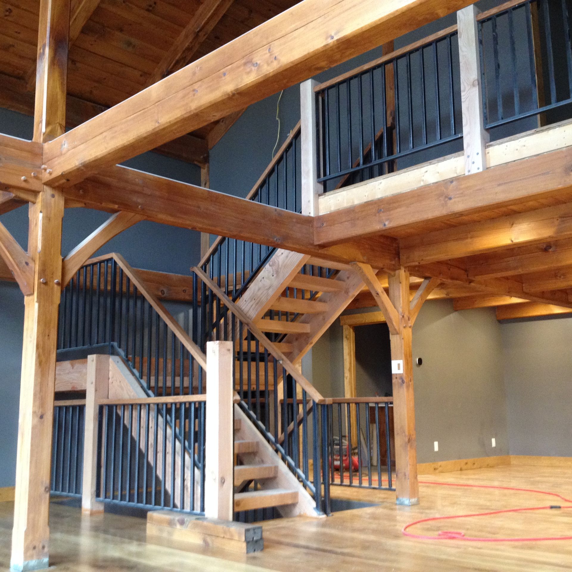 Vertical Bar Railing With Oak Top Rails