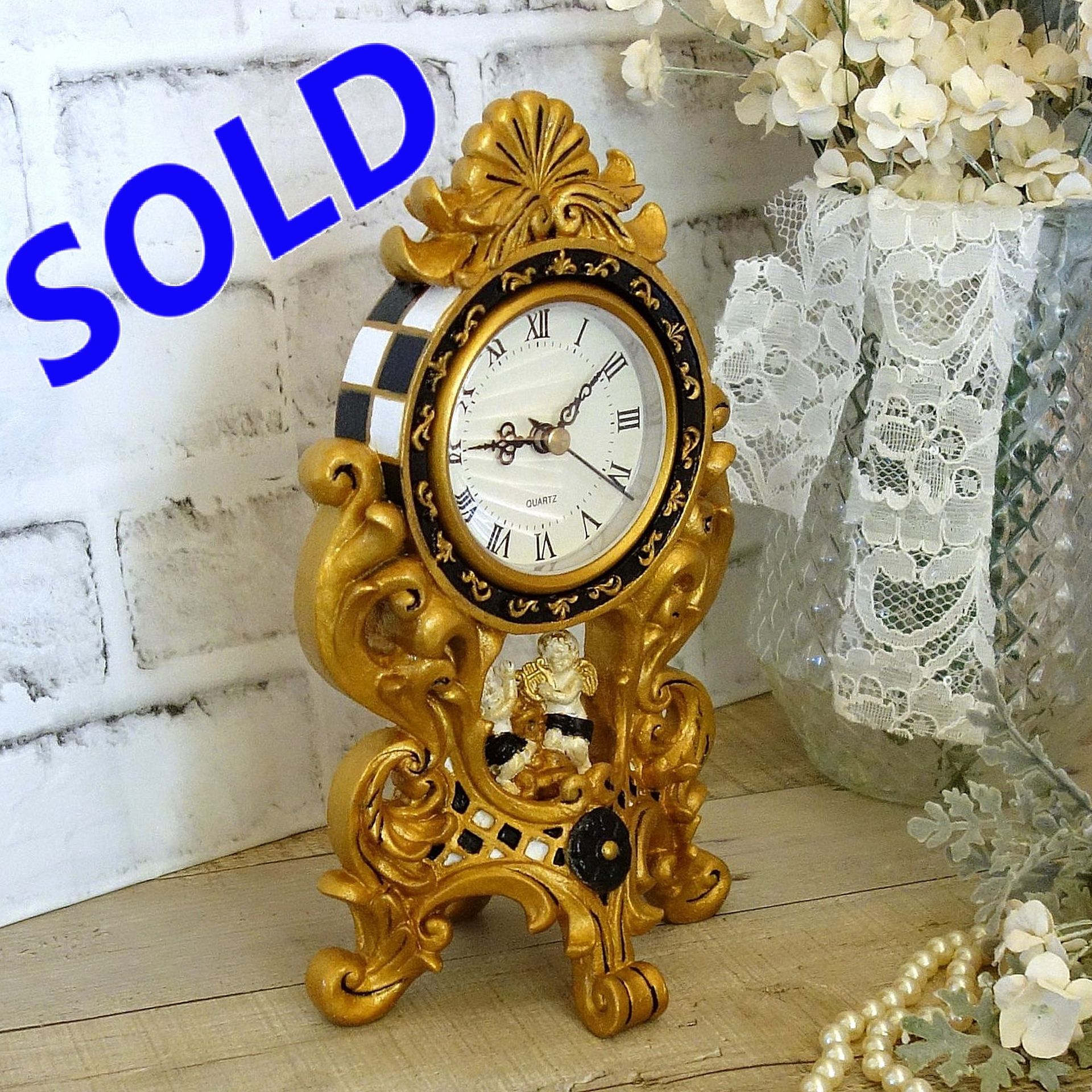 Courtly Mantle Clock Black And White Checked Baroque Clock With Cherubs