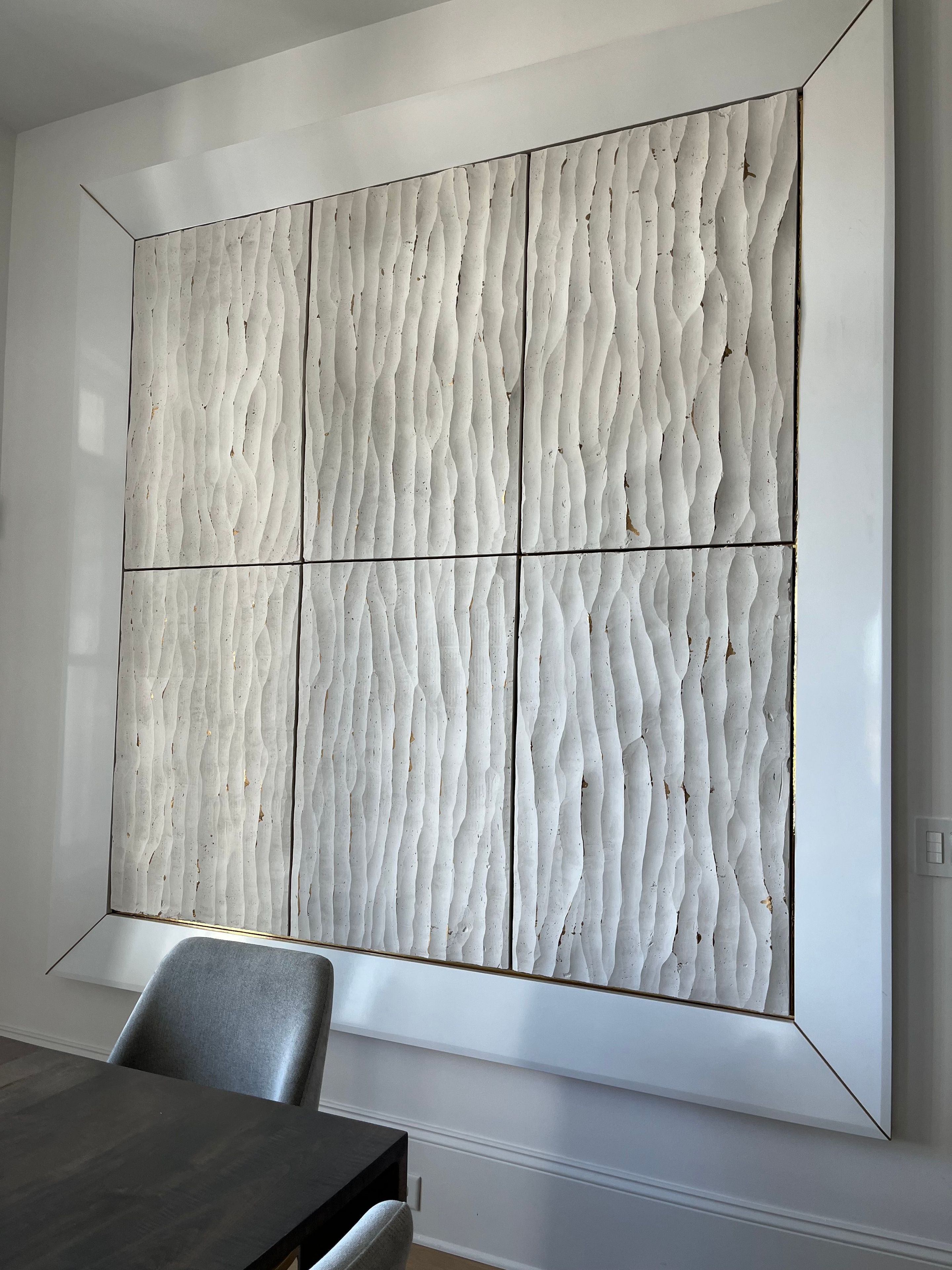 Carved plaster wall hanging