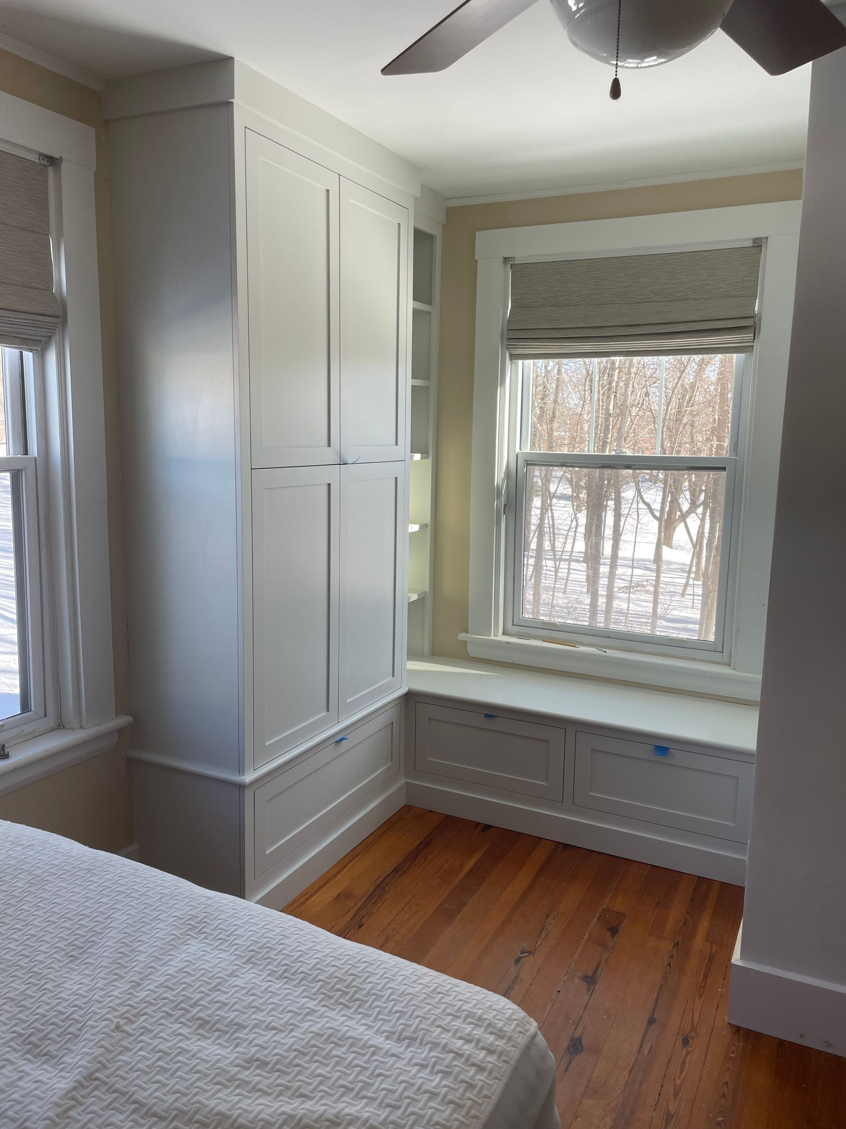 Custom nook bench with pullout drawers and armoire with shelving 3