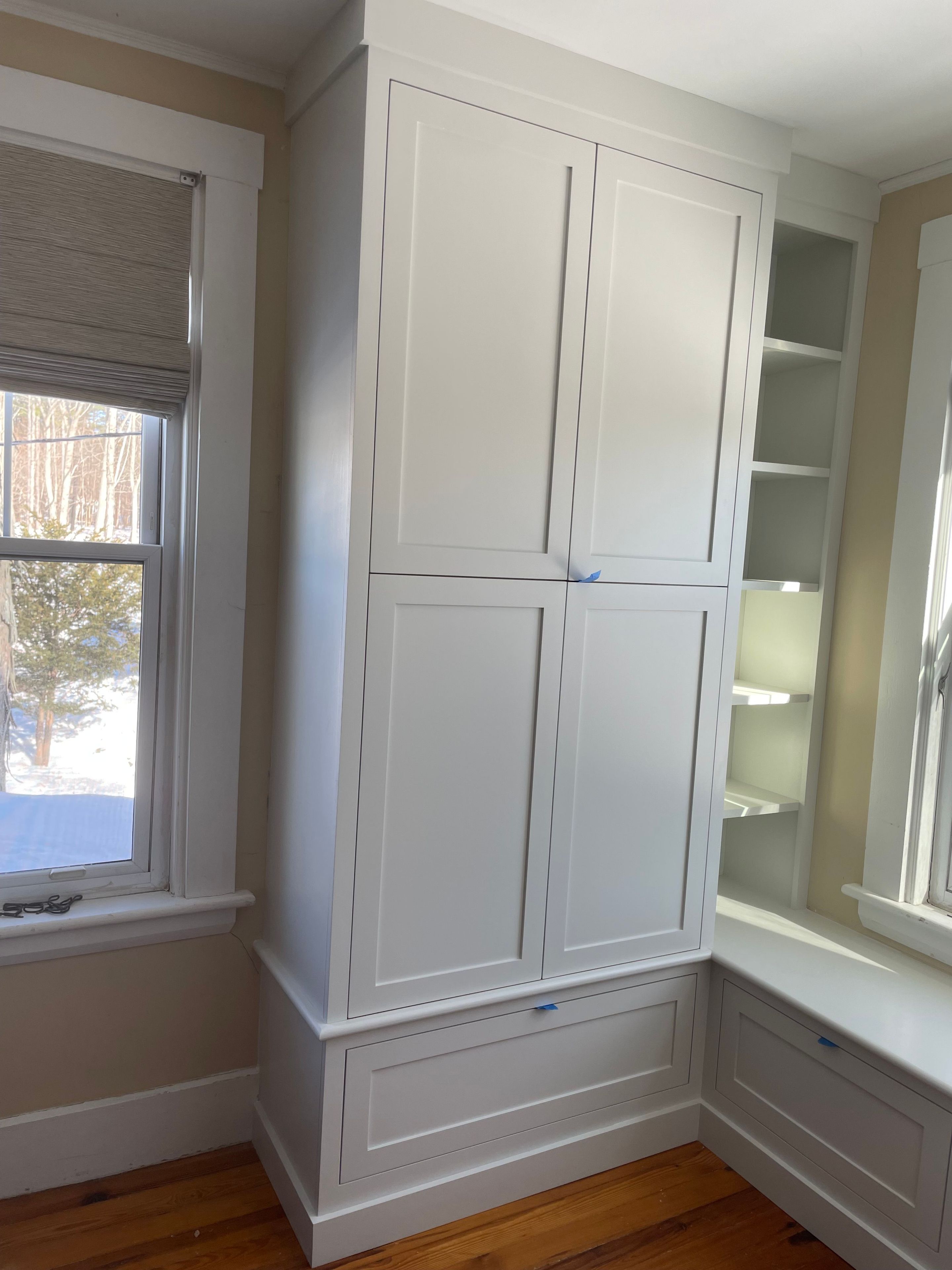 Custom nook bench with pullout drawers and armoire with shelving 4